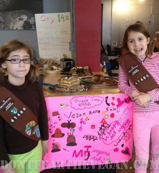Isabel and Anzia with the awesome sign their troop created!