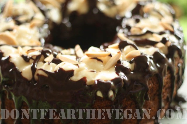 Banana cake with marshmallow white chocolate fluff, chocolate drizzle and almonds